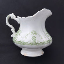 Load image into Gallery viewer, Vintage green transferware pattern on white ironstone creamer. Crafted by J.H.W. & Sons, England, early 20th century. Early English Ironstone is known for its simplicity of design and has been a favourite of collectors for decades. Its simple elegance lends it nicely to many decor styles including shabby chic, cottage, victorian, farmhouse, industrial and everything in between.
In vintage condition, two chips to the foot, no cracks. Stamped on the bottom.