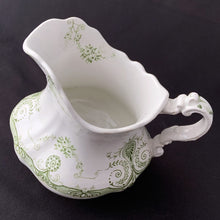 Load image into Gallery viewer, Vintage green transferware pattern on white ironstone creamer. Crafted by J.H.W. & Sons, England, early 20th century. Early English Ironstone is known for its simplicity of design and has been a favourite of collectors for decades. Its simple elegance lends it nicely to many decor styles including shabby chic, cottage, victorian, farmhouse, industrial and everything in between.
In vintage condition, two chips to the foot, no cracks. Stamped on the bottom.