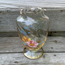 Load image into Gallery viewer, This is a lovely swirl optic glass urn-shaped footed vase with a ruffled edge. The hand painted enamel florals are beautifully done in shades of pink, yellow and blue with gold gilt leaves, bands and rim. Overall excellent vintage condition, free from chips/cracks. Measures 5 1/2 x 8 1/2 inches