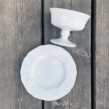 Load image into Gallery viewer, Vintage Harvest grape vines white milk glass sherbet dish or tall champagne glass with underplate. Crafted by Indiana Glass, USA, 1970s. Perfect for serving desserts or champagne!
In excellent condition, no chips.
Sherbet measures 4 x 3 1/8 inches, plate measures 6 1/4 inches