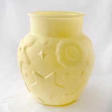 Load image into Gallery viewer, This charming Hazel Atlas glass cookie jar in soft yellow. It has delightful embossed cookie cutter details of gingerbread men, stars, cookies, diamonds, etc. We have the lid, but it didn't make it into the pix.
In excellent condition, no chips cracks or scuffs. Circa 1950s.
Measures 7 x 7 1/2 inches