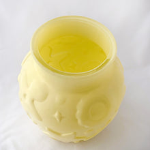 Load image into Gallery viewer, This charming Hazel Atlas glass cookie jar in soft yellow. It has delightful embossed cookie cutter details of gingerbread men, stars, cookies, diamonds, etc. We have the lid, but it didn't make it into the pix.
In excellent condition, no chips cracks or scuffs. Circa 1950s.
Measures 7 x 7 1/2 inches