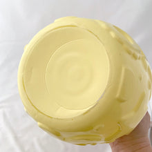 Load image into Gallery viewer, This charming Hazel Atlas glass cookie jar in soft yellow. It has delightful embossed cookie cutter details of gingerbread men, stars, cookies, diamonds, etc. We have the lid, but it didn't make it into the pix.
In excellent condition, no chips cracks or scuffs. Circa 1950s.
Measures 7 x 7 1/2 inches