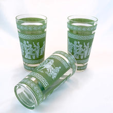 Load image into Gallery viewer, Vintage mid-century green and white Hellenic highball glasses feature a Jasperware-like design featuring a motif of toga-wearing figures, horses, chariots, topped with Greek key and palm leaves. Crafted by Jeannette Glass, USA, 1960s. These glasses were literally is everyone's rec rooms back in the day!
Measures 3 x 5 3/4 inches
Capacity 9 ounces