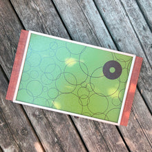 Load image into Gallery viewer, At any family dinner, my grandmother used her vintage Electric Warming Tray to keep all her yummy dishes hot. Worked like a charm! This one brings back all those vibes with graphic brown circle design again a brilliant green background, with teak handles! Cornwall Appliances Ltd., Canada in 1975. In excellent condition, no chips or cracks in the glass top and the wood is in ex condition. In good working order. Original cord included. Overall measures 17-3/4" x 10-1/8"