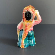 Load image into Gallery viewer, This little First Nations (Native American Indian) shaker is adorably kitschy. He is single and ready to mingle! He's a bit on the peppery side and is looking for a salty companion. Available for all meals. Cork is inside (oops). Made in Japan. The pottery is in excellent condition, no chips or cracks. Extremely nicely glazed, colours are vibrant. Measures 2 1/2 x 2 x 4 inches