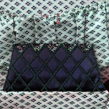 Load image into Gallery viewer, Gorgeous handmade mid-century vintage evening clutch bag covered in a diamond pattern of indigo blue seed beads and iridescent blue sequins with silver toned metal push button closure. The interior is lined with indigo coloured satin with a small pocket. The bag is large enough for a cell phone, credit cards/cash. Produced by Du-Val in Japan. An absolutely stunning piece that would make an incredible accessory. In overall excellent condition. Looks brand new
