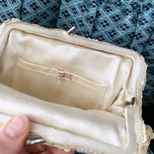 Load image into Gallery viewer, Gorgeous handmade mid-century vintage evening clutch bag covered in a iridescent cream sequins with matching finger strap and kiss closure. The interior is lined with cream coloured satin with a small pocket. The bag is large enough for a cell phone, credit cards/cash. Made in Belgium. An absolutely stunning piece that would make an incredible accessory. In overall excellent condition.