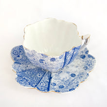 Load image into Gallery viewer, Rare and beautiful antique shell-shaped white bone china, blue "Daisy" teacup and saucer. Produced by JF Wileman, the precursor to Foley and Shelley in England, circa 1889. A must-have for the Foley and Shelley collector! In good condition, free from chips/cracks/crazing. Impressed registration mark "115540" and stamped registration mark "Rd117220" with painted "6021" in gold denoting the pattern name. Some wear to the gold. Teacup measures 3 1/2 x 2 1/4 inches Saucer measures 5 1/2 inches