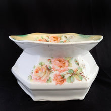 Load image into Gallery viewer, Vintage hexagon-shaped porcelain ladies spittoon, decorated with sprays of beautiful peach roses in a six sided shape. Marked Germany. Early 20th century. Repurpose this piece into a stunning vessel for a houseplant. In good vintage condition, with 1 minor chip to the rim which is barely noticeable. Dimensions: 7-1/4" x 4"