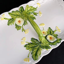 Load image into Gallery viewer, This lovely hand painted vintage majolica divided serving tray has a handle for carrying and the base of the handle has green leaf sprays with yellow daisies. The tray is bordered in a basketweave pattern (shape 4122). This tray is highly collectible and a great example of adorable kitsch ceramics from the mid-century era. Produced by Geo Z. Lefton in Japan. In excellent condition, no chips or cracks. Measures 13 x 7 x 1 1/2 inches