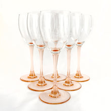 Load image into Gallery viewer, Delightful pink stemmed claret wine glasses in the "Rose" pattern. Set of six. Produced in France by Luminarc, circa 2000. In excellent condition, free from chips/cracks. Marked "France" and "luminarc" on the bottom. Measures 2-3/4" x 7-1/4"