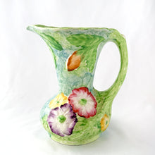 Load image into Gallery viewer, Side view of majolica pitcher, poppy pattern in purple/pink/yellow, blue-green glaze, James Kent Fenton, England 1930s 1940s