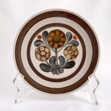 Load image into Gallery viewer, Vintage Mayflower bread and butter plate with rich tones of brown, tan and gray florals with brown bands. Designed by Gill Pemberton and produced by Denby in England, between 1965 - 1982. Rich and warm perfectly describes the cozy vibes of this tableware.
In good vintage condition, no chips/cracks, minor wear.
Measures 6 5/8 inches