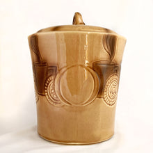 Load image into Gallery viewer, Check out this cool figural ceramic coffee cup shaped cookie jar decorated with steaming cups of hot bevvies and cookies and the lid is super cute with a curled cloud of steam for a handle. Produced by McCoy Pottery in the USA, between 1963-1966. Marked "USA" on the handle. A wonderful collectible to add charm to your kitchen decor or coffee station.
In excellent condition, free from chips/cracks/repairs.
Measures 7 1/2 x 9 1/4 inches