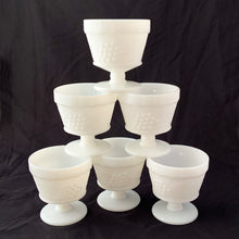 Load image into Gallery viewer, vintage mid-century milk glass champagne or tall sherbets. Anchor Hocking Glass for Big Top Peanut Butter promo for Proctor and Gamble. These dishes feature a cluster of grapes on a vine against a stippled background with a scalloped border at the rim. Perfect for serving shrimp cocktail, desserts or champagne. They may even be used as planters or to hold small office supplies. In excellent condition, free from chips/cracks. Measures 3 1/2 x 3 1/8 inches
