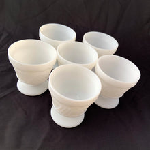 Load image into Gallery viewer, vintage mid-century milk glass champagne or tall sherbets. Anchor Hocking Glass for Big Top Peanut Butter promo for Proctor and Gamble. These dishes feature a cluster of grapes on a vine against a stippled background with a scalloped border at the rim. Perfect for serving shrimp cocktail, desserts or champagne. They may even be used as planters or to hold small office supplies. In excellent condition, free from chips/cracks. Measures 3 1/2 x 3 1/8 inches