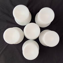 Load image into Gallery viewer, vintage mid-century milk glass champagne or tall sherbets. Anchor Hocking Glass for Big Top Peanut Butter promo for Proctor and Gamble. These dishes feature a cluster of grapes on a vine against a stippled background with a scalloped border at the rim. Perfect for serving shrimp cocktail, desserts or champagne. They may even be used as planters or to hold small office supplies. In excellent condition, free from chips/cracks. Measures 3 1/2 x 3 1/8 inches