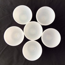 Load image into Gallery viewer, vintage mid-century milk glass champagne or tall sherbets. Anchor Hocking Glass for Big Top Peanut Butter promo for Proctor and Gamble. These dishes feature a cluster of grapes on a vine against a stippled background with a scalloped border at the rim. Perfect for serving shrimp cocktail, desserts or champagne. They may even be used as planters or to hold small office supplies. In excellent condition, free from chips/cracks. Measures 3 1/2 x 3 1/8 inches