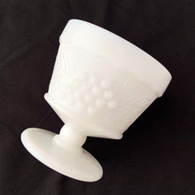 Load image into Gallery viewer, vintage mid-century milk glass champagne or tall sherbets. Anchor Hocking Glass for Big Top Peanut Butter promo for Proctor and Gamble. These dishes feature a cluster of grapes on a vine against a stippled background with a scalloped border at the rim. Perfect for serving shrimp cocktail, desserts or champagne. They may even be used as planters or to hold small office supplies. In excellent condition, free from chips/cracks. Measures 3 1/2 x 3 1/8 inches