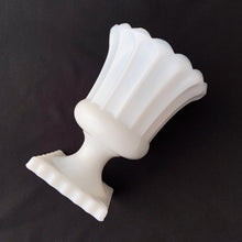 Load image into Gallery viewer, Grecian style milk glass planted. Its fluted shape is ultra feminine and would be perfect for a pretty floral display, or your favourite house plant. Or repurpose as a candy dish, pencil or make-up brush holder. Produced by Hazel-Atlas Glass, USA. In excellent condition, no chips or cracks. Measures 4 1/2 x 6 inches