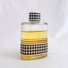 Load image into Gallery viewer, Vintage partial 2 ounce bottle of 'Miss Dior' eau de toilette. Created by perfumer François Demachy for Christian Dior, Paris France. As Dior's debut fragrance, Miss Dior was introduced in 1947 alongside the first Christian Dior collection in Paris at 30 Avenue Montaigne. While this is in used condition, the glass bottle and label are in excellent condition. Approximately 1 1/2 ounces remain in the bottle.