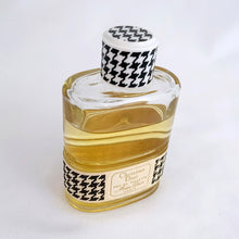 Load image into Gallery viewer, Vintage partial 2 ounce bottle of 'Miss Dior' eau de toilette. Created by perfumer François Demachy for Christian Dior, Paris France. As Dior's debut fragrance, Miss Dior was introduced in 1947 alongside the first Christian Dior collection in Paris at 30 Avenue Montaigne. While this is in used condition, the glass bottle and label are in excellent condition. Approximately 1 1/2 ounces remain in the bottle.