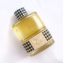 Load image into Gallery viewer, Vintage partial 2 ounce bottle of 'Miss Dior' eau de toilette. Created by perfumer François Demachy for Christian Dior, Paris France. As Dior's debut fragrance, Miss Dior was introduced in 1947 alongside the first Christian Dior collection in Paris at 30 Avenue Montaigne. While this is in used condition, the glass bottle and label are in excellent condition. Approximately 1 1/2 ounces remain in the bottle.