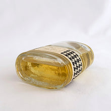Load image into Gallery viewer, Vintage partial 2 ounce bottle of 'Miss Dior' eau de toilette. Created by perfumer François Demachy for Christian Dior, Paris France. As Dior's debut fragrance, Miss Dior was introduced in 1947 alongside the first Christian Dior collection in Paris at 30 Avenue Montaigne. While this is in used condition, the glass bottle and label are in excellent condition. Approximately 1 1/2 ounces remain in the bottle.