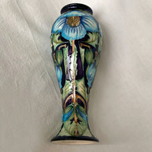 Load image into Gallery viewer, Collectors Club 2004 Limited Edition "Meconopsis" or Himalayan Poppy art pottery vase, numbered 97/150. This piece is hand painted in the slip glaze technique on a deep blue ground with shades of blue, yellow, brown and green. Designed by Rachel Bishop. Shape 75/10. Produced by Moorcroft Pottery, England, 2004. In excellent condition, no chips, cracks or repairs. First quality. Offered from our personal collection. Measures 4-1/2" x 11"