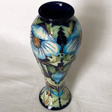 Load image into Gallery viewer, Collectors Club 2004 Limited Edition "Meconopsis" or Himalayan Poppy art pottery vase, numbered 97/150. This piece is hand painted in the slip glaze technique on a deep blue ground with shades of blue, yellow, brown and green. Designed by Rachel Bishop. Shape 75/10. Produced by Moorcroft Pottery, England, 2004. In excellent condition, no chips, cracks or repairs. First quality. Offered from our personal collection. Measures 4-1/2" x 11"