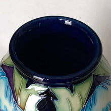 Load image into Gallery viewer, Collectors Club 2004 Limited Edition "Meconopsis" or Himalayan Poppy art pottery vase, numbered 97/150. This piece is hand painted in the slip glaze technique on a deep blue ground with shades of blue, yellow, brown and green. Designed by Rachel Bishop. Shape 75/10. Produced by Moorcroft Pottery, England, 2004. In excellent condition, no chips, cracks or repairs. First quality. Offered from our personal collection. Measures 4-1/2" x 11"