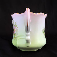 Load image into Gallery viewer, This vintage white porcelain shaving mug is hand painted with lovely pink and green florals with gold rim. Use as intended or repurpose as a toothbrush or make-up brush holder. Marked "Hand Painted Nippon". In excellent condition, no chips/cracks/repairs. Dimensions: 4-3/4" x 3-3/4"