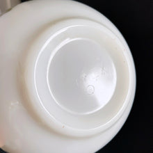 Load image into Gallery viewer, Fabulous find in this vintage PYREX "Spring Blossoms Green I" or commonly known as "Crazy Daisy" white milk glass Cinderella bowl with green daisy flowers on this 441, 1-1/2 pint beauty! Produced by Corning USA, first between 1972 to 1979 and again between 1979 to 1981. In excellent condition, no chips or cracks. Looks like it hasn't seen a dishwasher and the pattern in shiny and vibrant. Measures 7-1/2" x 3-1/8" (handle-handle)