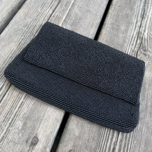 Load image into Gallery viewer, This is one of the nicest, well-cared for and preserved mid-century glass seed beaded evening clutch purses we've encountered. It has a stunning hand sewn beadwork, a black satin interior lining and a nifty pinch/squeeze closure. A super glam piece of vintage fashion! Made in Hong Kong and imported by Aristo. The beading and interior satin are in mint condition. Measures 7-1/4" x 4-5/8"