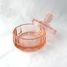 Load image into Gallery viewer, Stunning vintage twelve sided pink depression glass lidded vanity or trinket box with paneled finial. Circa 1930s.
In excellent vintage condition with one minor flea nic on the rim.
Measures 3 3/4 x 3 1/2 inches
