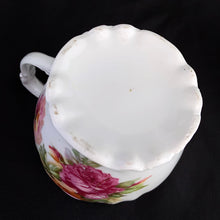 Load image into Gallery viewer, This vintage white porcelain shaving mug has with lovely pink and yellow roses with gold rim. Use as intended or repurpose as a toothbrush or make-up brush holder. Stamped "Welmar Germany". In excellent condition, no chips/cracks/repairs. Dimensions: 3-3/8" x 3-1/2"
