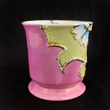 Load image into Gallery viewer, Vintage wood handled shaving brush and white porcelain shaving mug with raised slip details painted in pink, yellow and blue, highlighted in gold. Use as intended or repurpose as a toothbrush or make-up brush holder. Impressed mark "510" and painted "13". In good vintage condition, no cracks/repairs. The edge on the soap side is worn. Dimensions: 3-1/8" x 3"