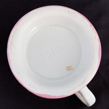 Load image into Gallery viewer, Vintage wood handled shaving brush and white porcelain shaving mug with raised slip details painted in pink, yellow and blue, highlighted in gold. Use as intended or repurpose as a toothbrush or make-up brush holder. Impressed mark "510" and painted "13". In good vintage condition, no cracks/repairs. The edge on the soap side is worn. Dimensions: 3-1/8" x 3"