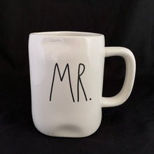 Load image into Gallery viewer, "MR." off white ceramic mug. Marked on the bottom, Rae Dunn Artisan Collection by Magenta 202. Rae Dunn's designs are instantly recognizable....they are mostly cream-colored tableware, typically emblazoned with one- or two-word phrases using a simple hand-written style font. In excellent condition free from chips/cracks/repairs. Measures 5 x 4 1/2 inches (includes handle) Capacity 16 ounces