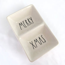 Load image into Gallery viewer, Contemporary Rae Dunn Artisan Collection divided ceramic dish featuring the words MERRY XMAS in Dunn's distinctive font. Produced by Magenta, China. Perfect to serve your favourite snacks, or repurpose as a trinket dish in your holiday decor.
In excellent condition, no chips/cracks/repairs.
Measures 8 1/4 x 5 3/8 x 2 1/4 inches