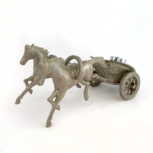 Load image into Gallery viewer, Unique and highly collectible vintage mid-century Roman horse drawn chariot table light made with cast silver-toned metal with chrome lighter. Definitely a conversation piece! Chariot swivels, but we're unsure whether or not it's a flaw. Otherwise in great vintage condition with nice patina. Lighter needs flint and lighter fluid or butane post-shipping. Unmarked. Measures 7-1/2" x 3-1/2" x 3-1/4"