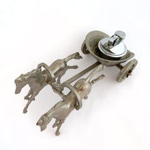Load image into Gallery viewer, Unique and highly collectible vintage mid-century Roman horse drawn chariot table light made with cast silver-toned metal with chrome lighter. Definitely a conversation piece! Chariot swivels, but we're unsure whether or not it's a flaw. Otherwise in great vintage condition with nice patina. Lighter needs flint and lighter fluid or butane post-shipping. Unmarked. Measures 7-1/2" x 3-1/2" x 3-1/4"