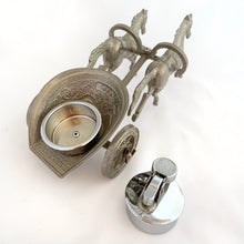 Load image into Gallery viewer, Unique and highly collectible vintage mid-century Roman horse drawn chariot table light made with cast silver-toned metal with chrome lighter. Definitely a conversation piece! Chariot swivels, but we're unsure whether or not it's a flaw. Otherwise in great vintage condition with nice patina. Lighter needs flint and lighter fluid or butane post-shipping. Unmarked. Measures 7-1/2" x 3-1/2" x 3-1/4"