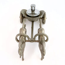 Load image into Gallery viewer, Unique and highly collectible vintage mid-century Roman horse drawn chariot table light made with cast silver-toned metal with chrome lighter. Definitely a conversation piece! Chariot swivels, but we're unsure whether or not it's a flaw. Otherwise in great vintage condition with nice patina. Lighter needs flint and lighter fluid or butane post-shipping. Unmarked. Measures 7-1/2" x 3-1/2" x 3-1/4"