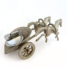 Load image into Gallery viewer, Unique and highly collectible vintage mid-century Roman horse drawn chariot table light made with cast silver-toned metal with chrome lighter. Definitely a conversation piece! Chariot swivels, but we're unsure whether or not it's a flaw. Otherwise in great vintage condition with nice patina. Lighter needs flint and lighter fluid or butane post-shipping. Unmarked. Measures 7-1/2" x 3-1/2" x 3-1/4"