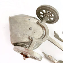 Load image into Gallery viewer, Unique and highly collectible vintage mid-century Roman horse drawn chariot table light made with cast silver-toned metal with chrome lighter. Definitely a conversation piece! Chariot swivels, but we're unsure whether or not it's a flaw. Otherwise in great vintage condition with nice patina. Lighter needs flint and lighter fluid or butane post-shipping. Unmarked. Measures 7-1/2" x 3-1/2" x 3-1/4"