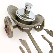 Load image into Gallery viewer, Unique and highly collectible vintage mid-century Roman horse drawn chariot table light made with cast silver-toned metal with chrome lighter. Definitely a conversation piece! Chariot swivels, but we're unsure whether or not it's a flaw. Otherwise in great vintage condition with nice patina. Lighter needs flint and lighter fluid or butane post-shipping. Unmarked. Measures 7-1/2" x 3-1/2" x 3-1/4"