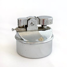 Load image into Gallery viewer, Unique and highly collectible vintage mid-century Roman horse drawn chariot table light made with cast silver-toned metal with chrome lighter. Definitely a conversation piece! Chariot swivels, but we're unsure whether or not it's a flaw. Otherwise in great vintage condition with nice patina. Lighter needs flint and lighter fluid or butane post-shipping. Unmarked. Measures 7-1/2" x 3-1/2" x 3-1/4"