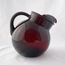 Load image into Gallery viewer, A super cool vintage Royal Ruby Roly Poly ice lip glass pitcher with ribbed collar and handle. Crafted by Anchor Hocking, USA, 1950s. A great addition to your barware collection and perfect for the holiday season!
In good vintage condition, no chips, minor wear in one spot.
Measures 7 x 5 x 6 1/2 inches
Capacity 32 ounces